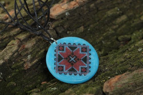 Handmade designer pendant with Ukrainian symbols round blue accessory on cord  - MADEheart.com