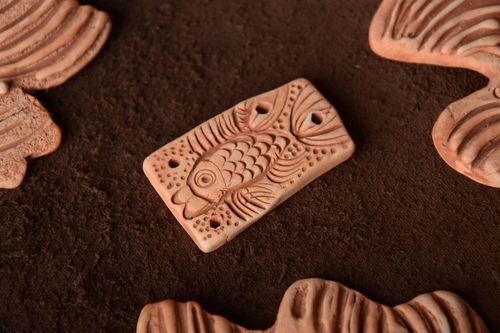Handmade rectangular unpainted flat ceramic pendant with embossed fish pattern  - MADEheart.com