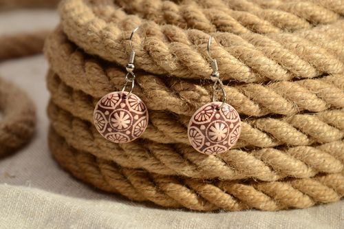 Handmade clay dangle round earrings of brown color with ornament  - MADEheart.com