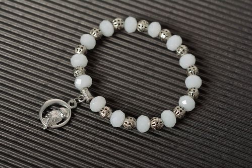 Handmade wrist bracelet with white plastic beads and metal charm for women - MADEheart.com