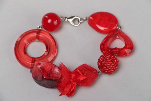 Handmade bright red wrist bracelet with plastic beads and metal fastener - MADEheart.com