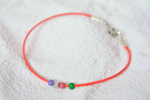 Handmade thin red bracelet cord with blue, green, blue, and silver beads - MADEheart.com