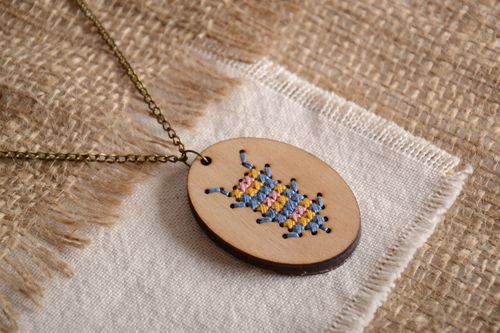 Handmade pendant on a long chain made of plywood with embroidery - MADEheart.com