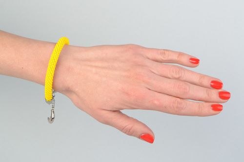 Handmade bright yellow beaded cord wrist bracelet with metal charm - MADEheart.com