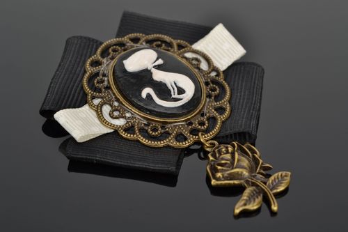 Handmade metal cameo brooch with charm in the shape of rose and ribbons - MADEheart.com