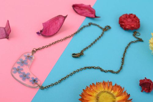Tender handmade transparent epoxy resin pendant with blue flowers on metal chain - MADEheart.com