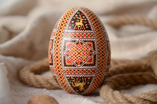Homemade decorative Easter egg ethnic pysanka painted with geometric ornaments - MADEheart.com