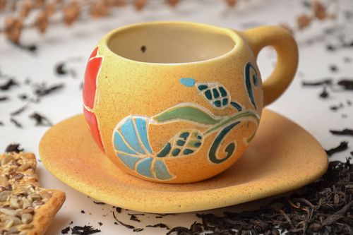 Clay yellow drinking cup with floral pattern with handle and saucer  - MADEheart.com