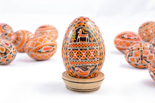 Painted Easter egg with the image of fish and deers - MADEheart.com