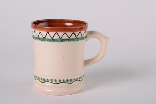 Ceramic beige color coffee or teacup with handle and simple floral pattern - MADEheart.com