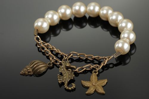Elegant handmade bracelet with artificial pearls and metal charms for women - MADEheart.com
