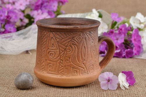 Non-glazed clay cup for tea or coffee with handle and Ukrainian country symbol - MADEheart.com
