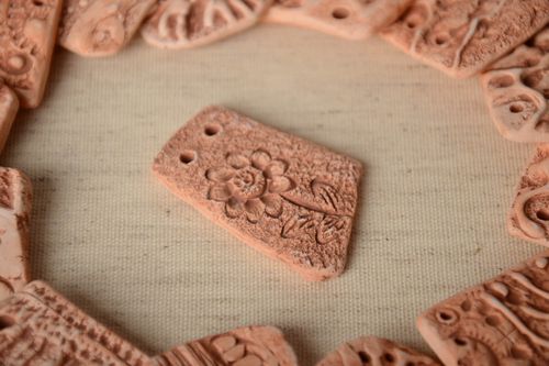 Handmade small flat ceramic pendant for painting with scratched flower pattern  - MADEheart.com