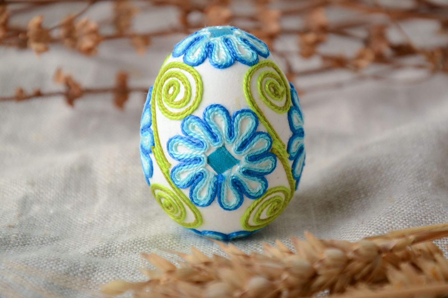 Beautiful Easter egg decorated with threads photo 1