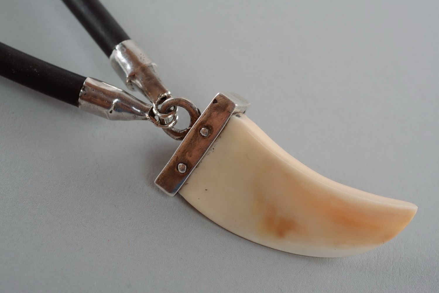 Pendant made of a wild boar's tusk photo 5