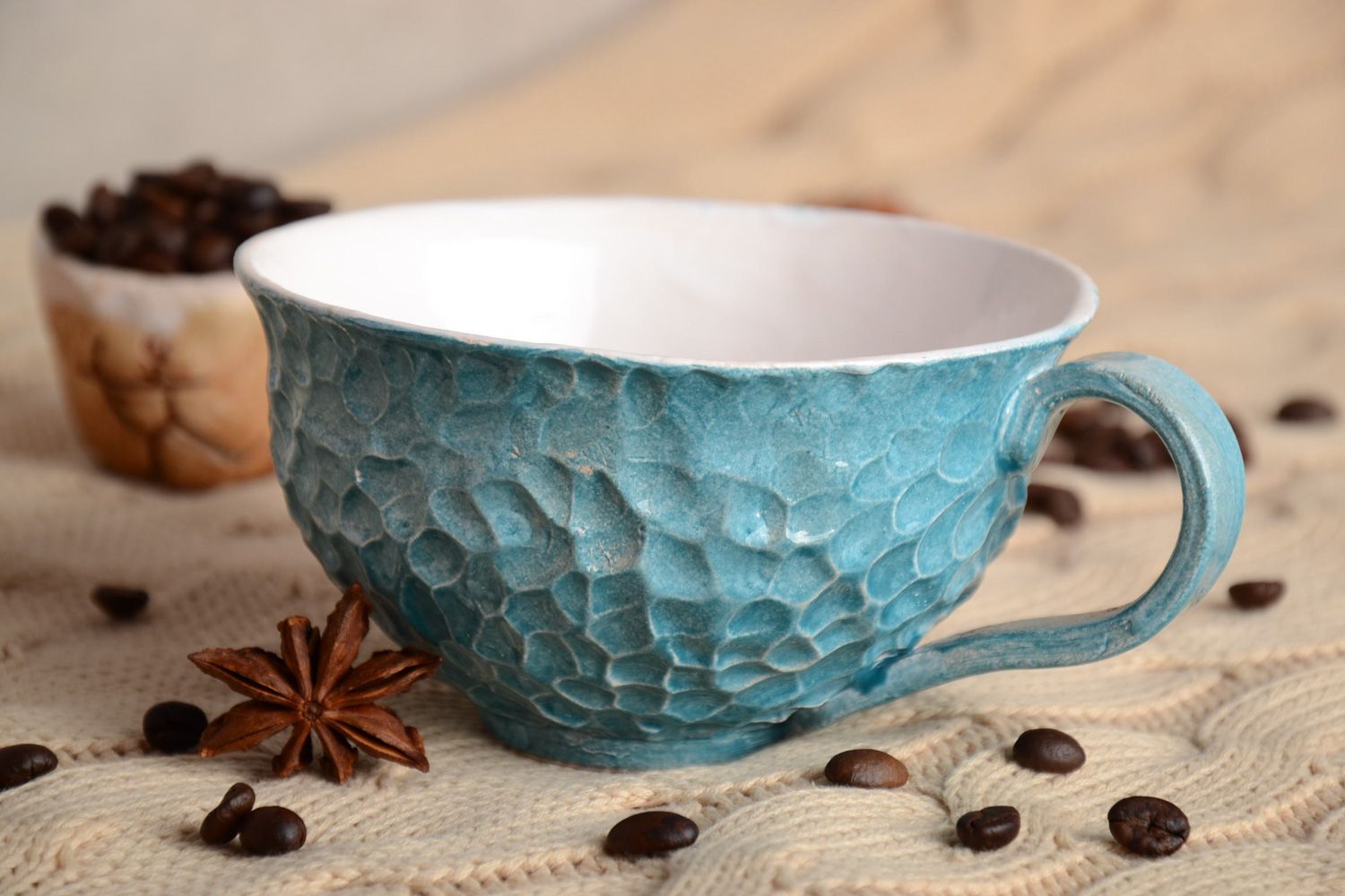 Light blue elegant teacup with handle and molded pattern photo 1