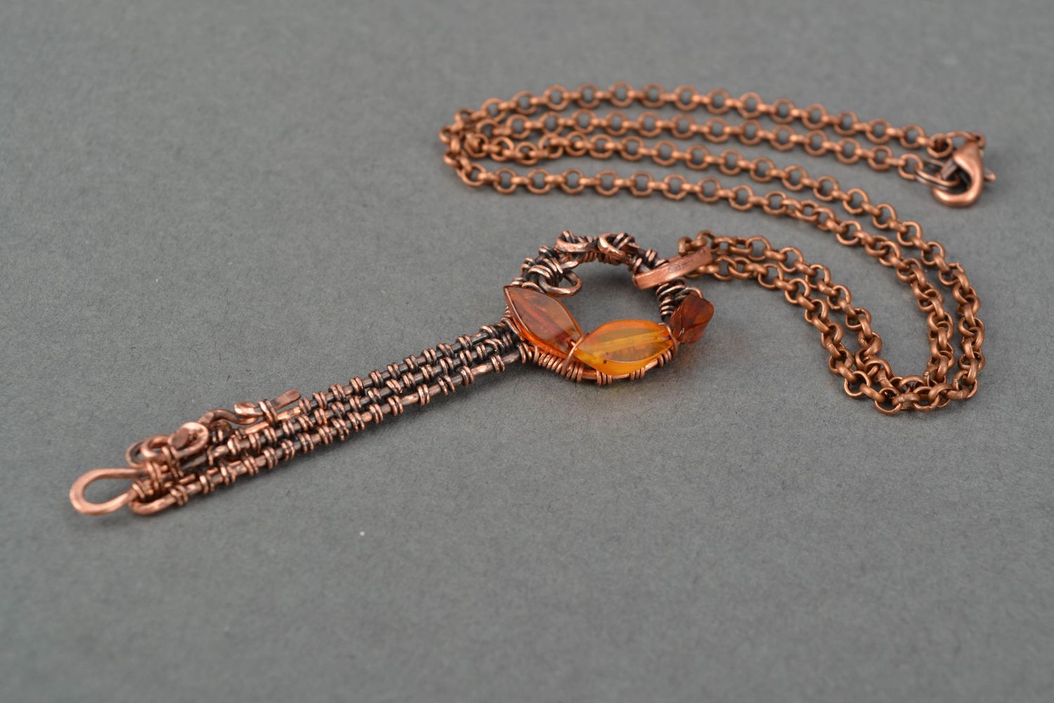 Wire wrap copper pendant with natural stone Amber Key photo 4
