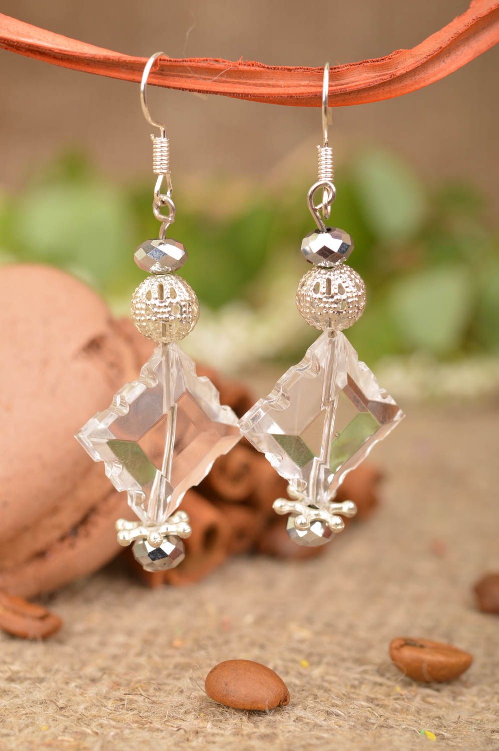 Unusual festive handmade earrings made of transparent beads with charms photo 1