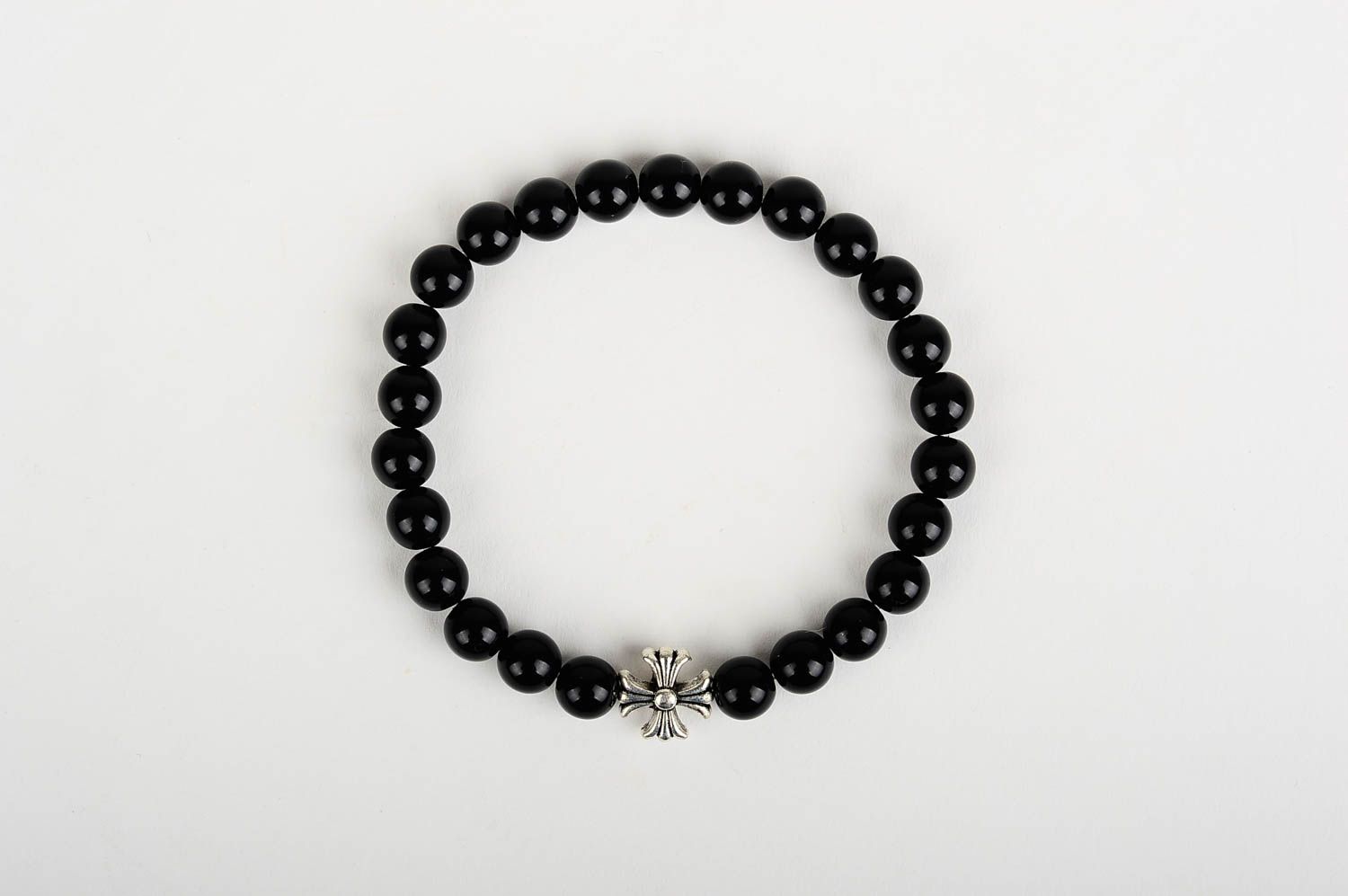 Metal cross and black beads unisex bracelet on an elastic string photo 1