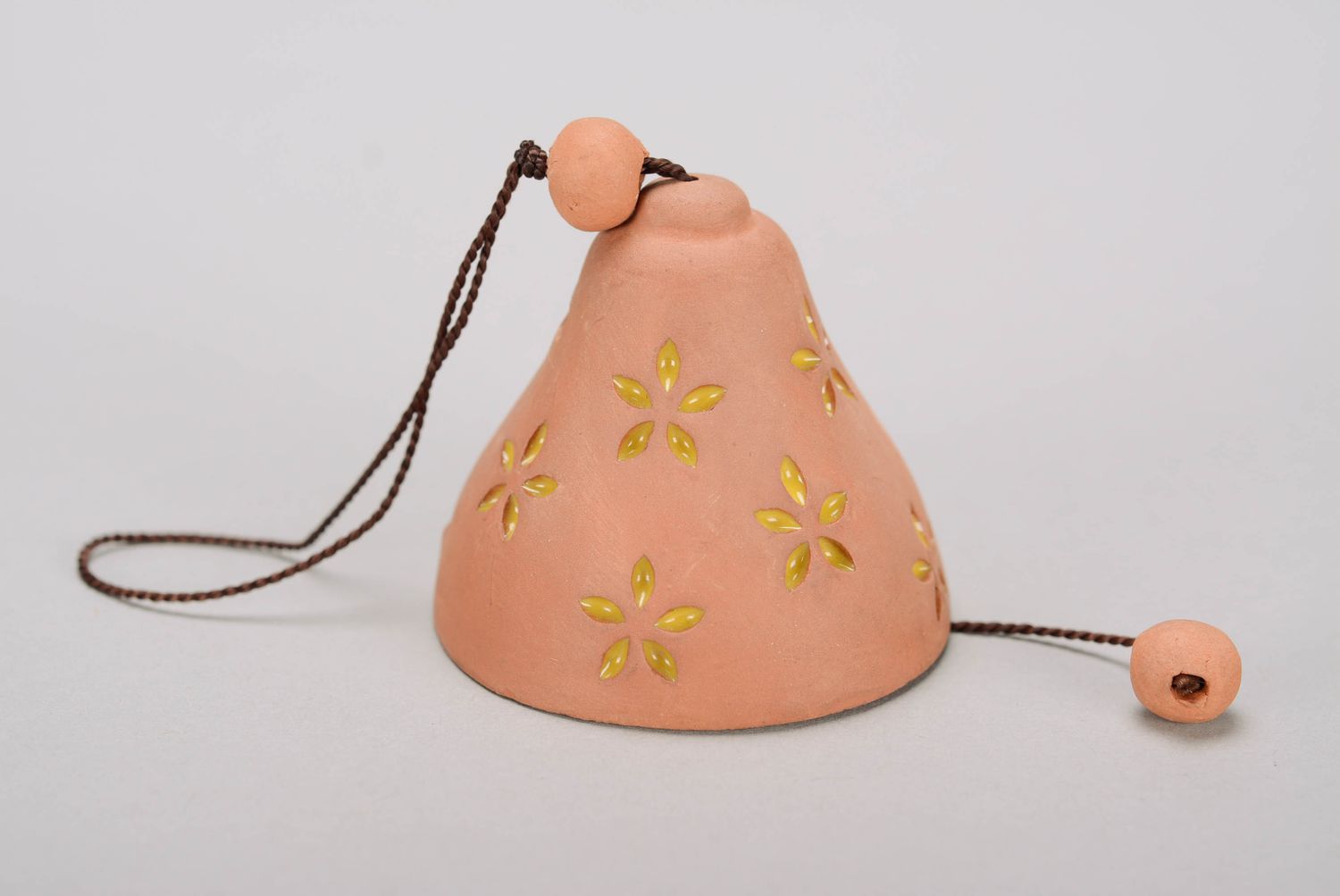 Bell made of red clay photo 3