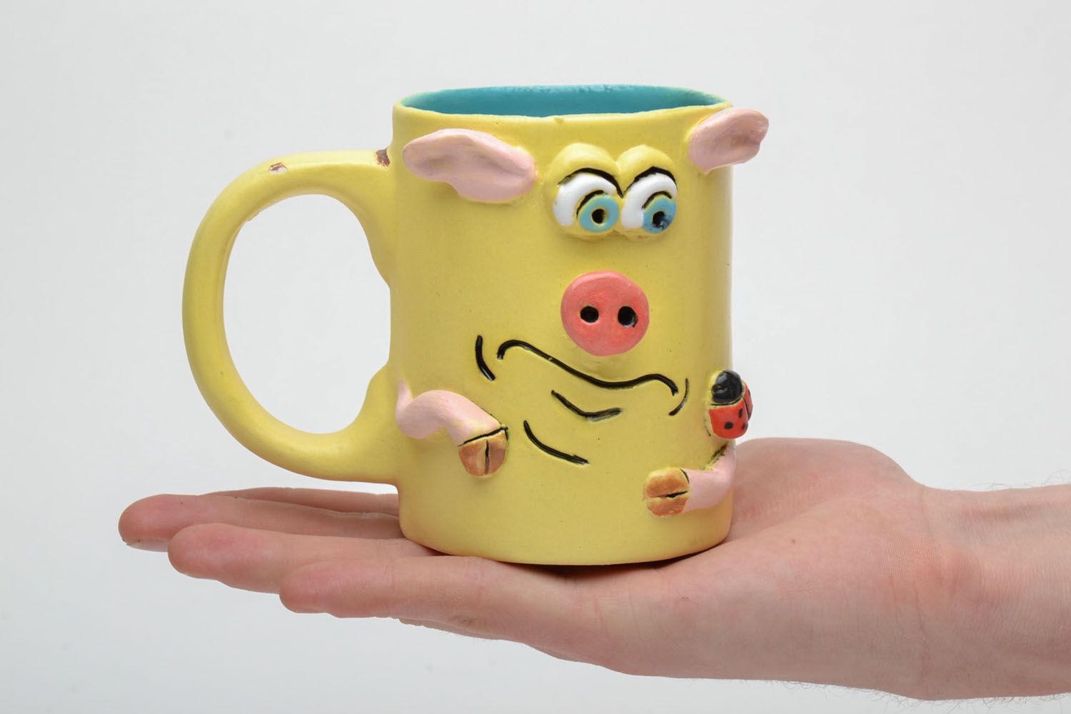 Yellow ceramic glazed kids' drinking cup with handle and piggy pattern photo 5