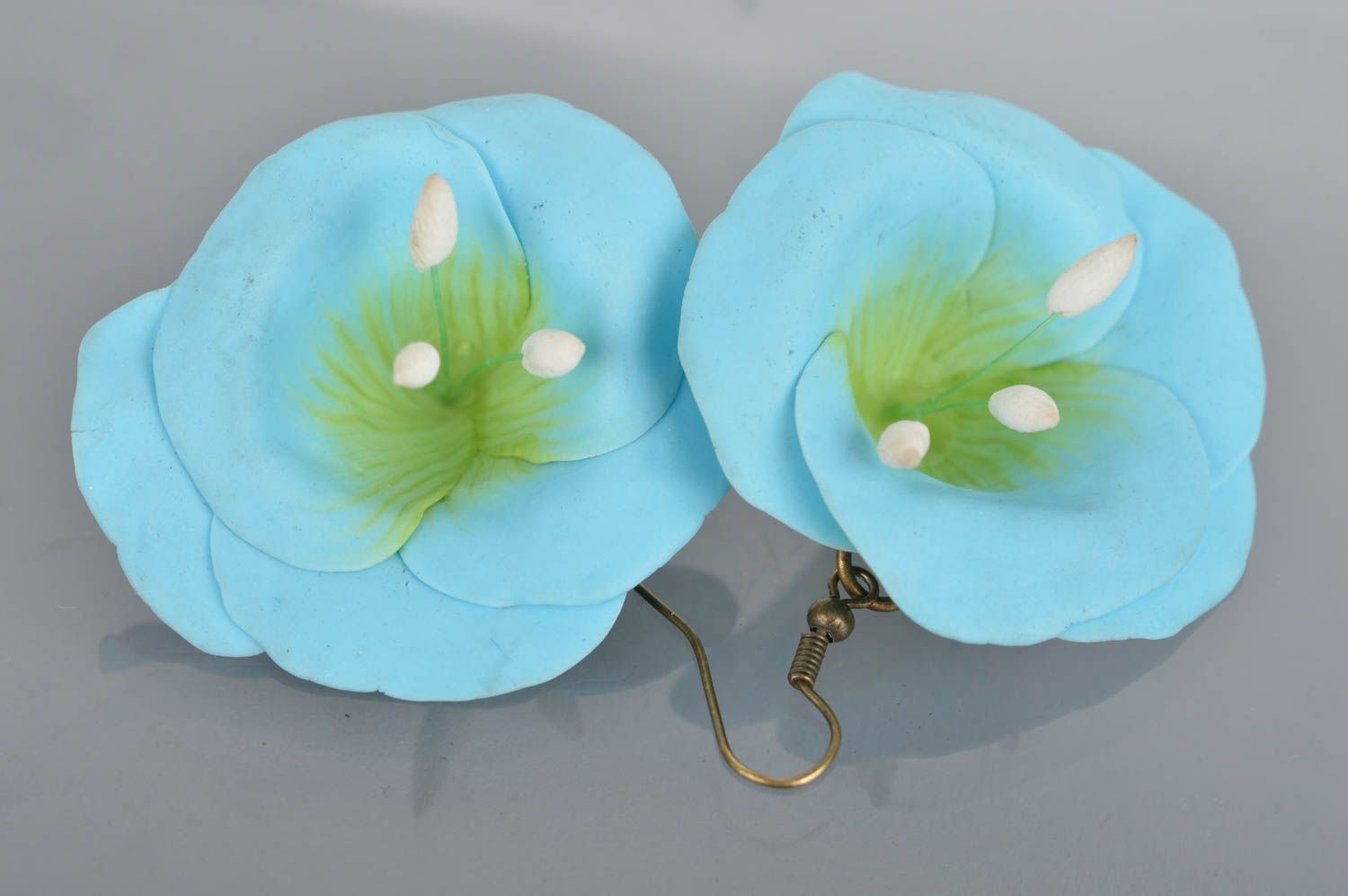 Handmade female earrings made of polymer clay in shape of blue flowers photo 2