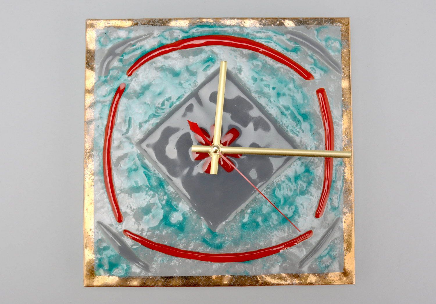 Reloj de pared de vidrio “El aro de oro” foto 1