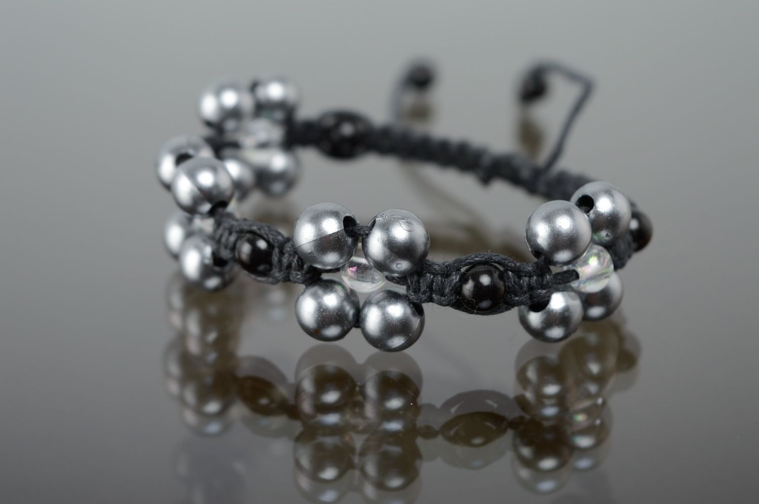 Macrame bracelet with ceramic beads of silver color photo 1