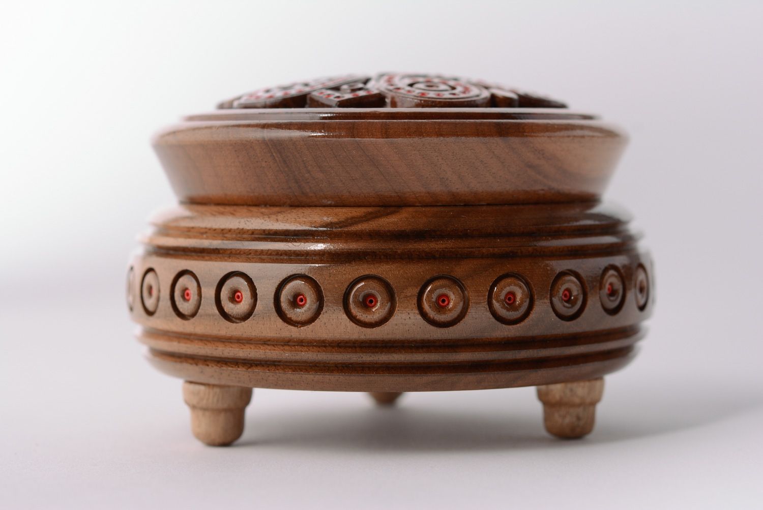 Round handmade jewelry box carved of wood and inlaid with beads on legs photo 2