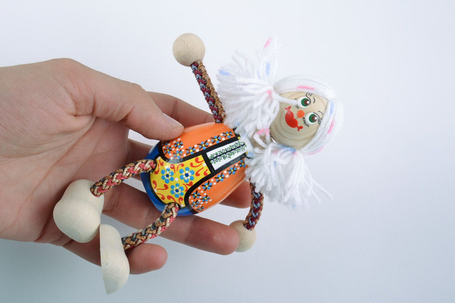 Handmade painted wooden eco toy funny girl in Ukrainian costume with white hair photo 2