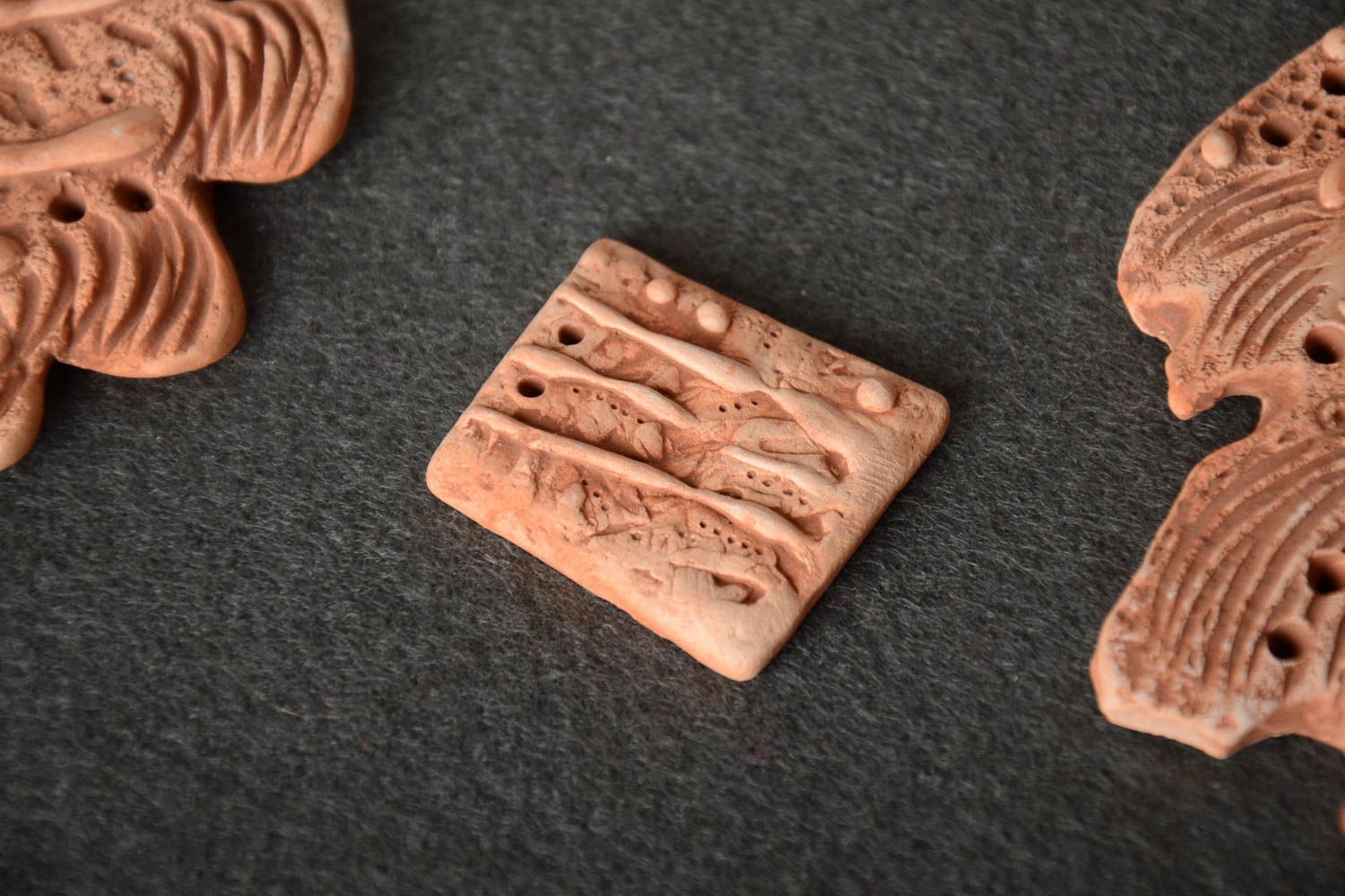 Homemade blank pendant molded of natural clay for ethnic jewelry making photo 1