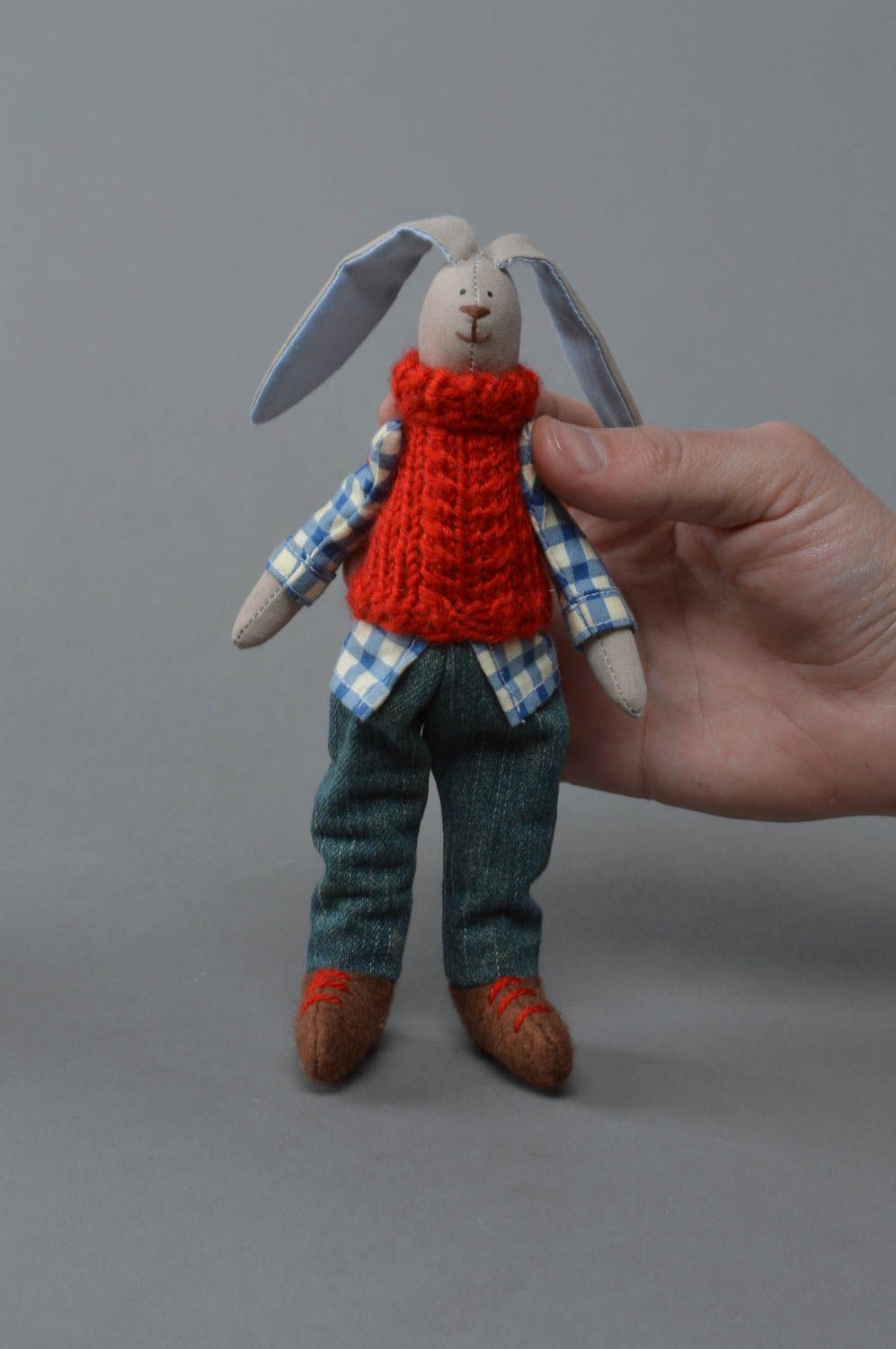 Handmade small fabric soft toy rabbit in red knit vest and checkered shirt photo 1