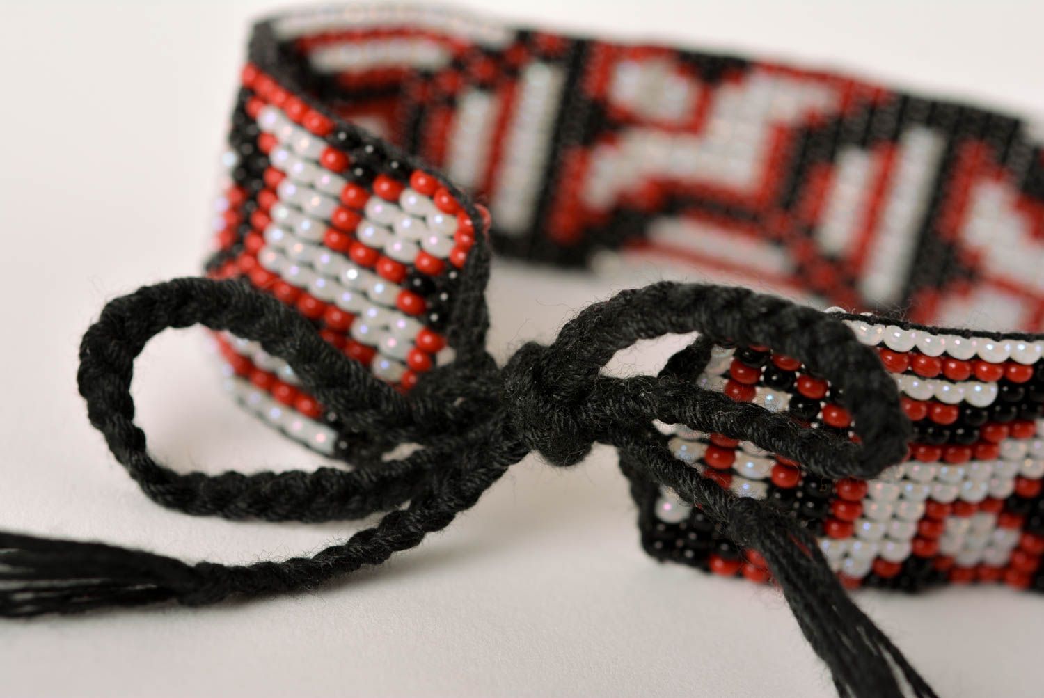 Handmade geometrical ornament beaded bracelet in black, red, gray color photo 4
