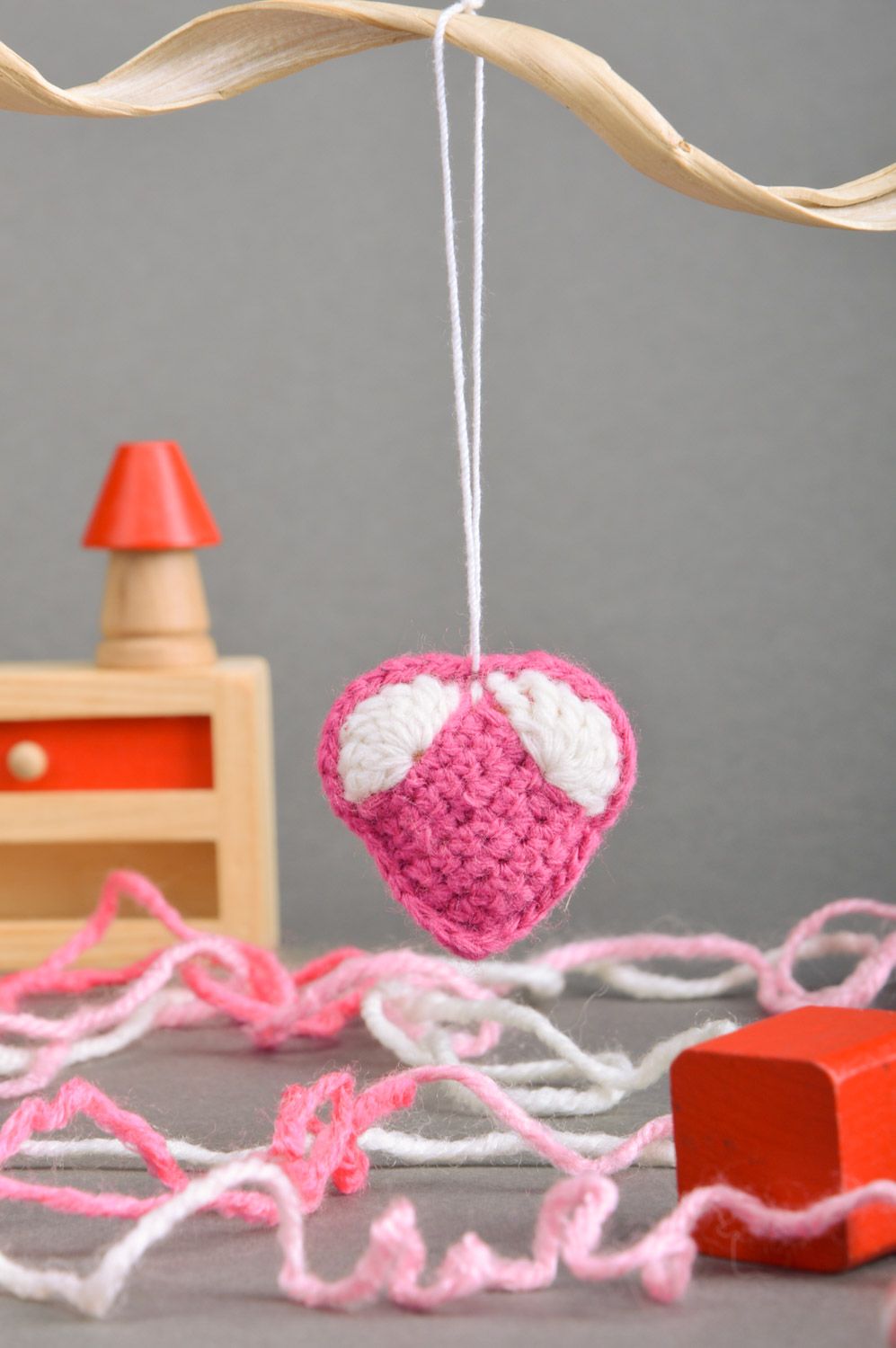 Handmade heart-shaped keychain crocheted of pink and white semi-woolen threads photo 1