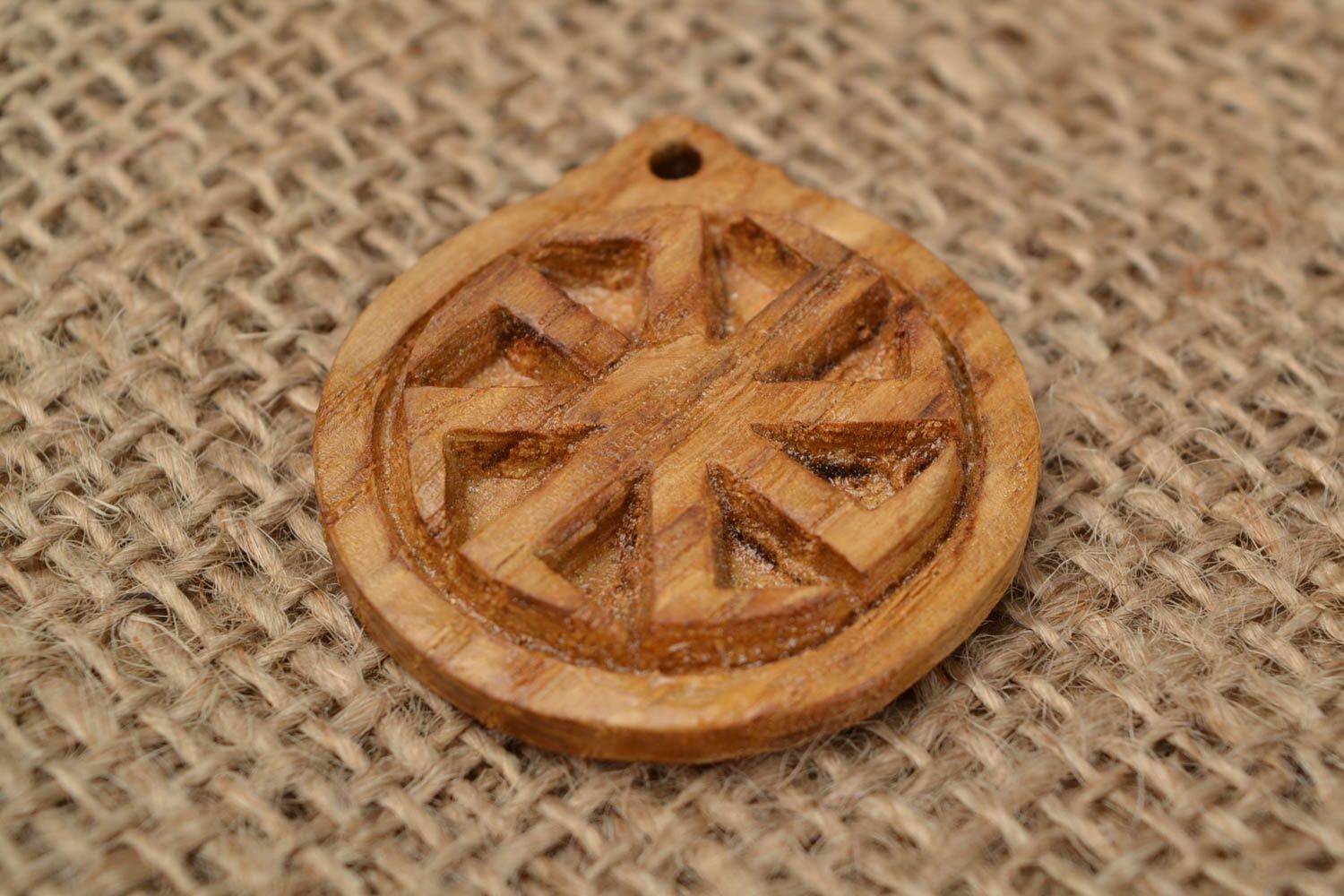 Handmade carved small round wooden neck pendant with Slavic symbol Kolovrat photo 1