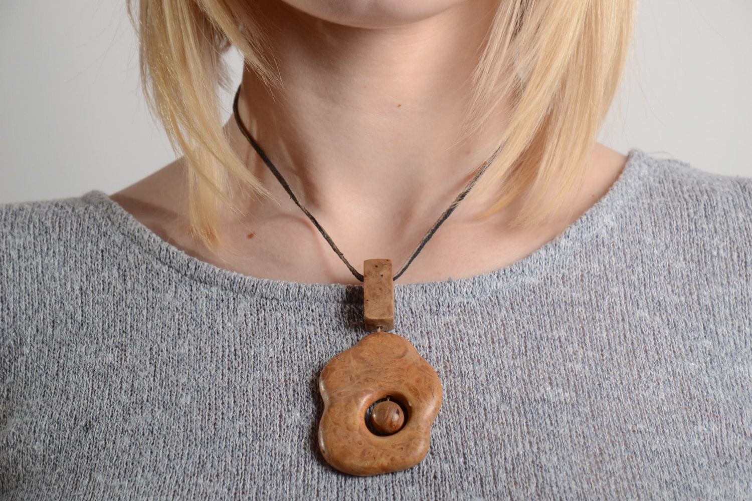 Handmade tinted varnished pendant carved of wood in ethic style for women photo 2
