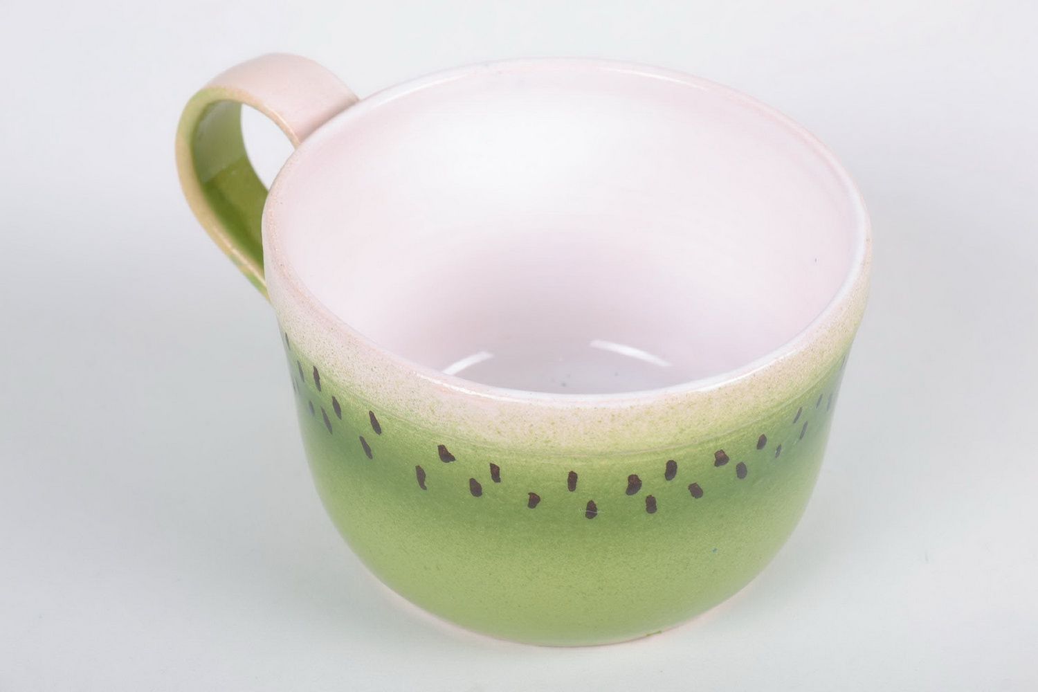 Ceramic glazed cup with handle in kiwi pattern photo 4