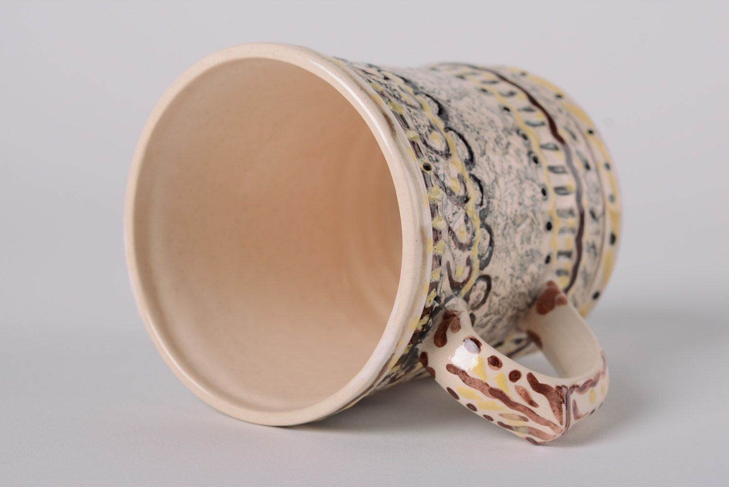 Handmade ceramic drinking mug for coffee and tea in yellow and brown color photo 4