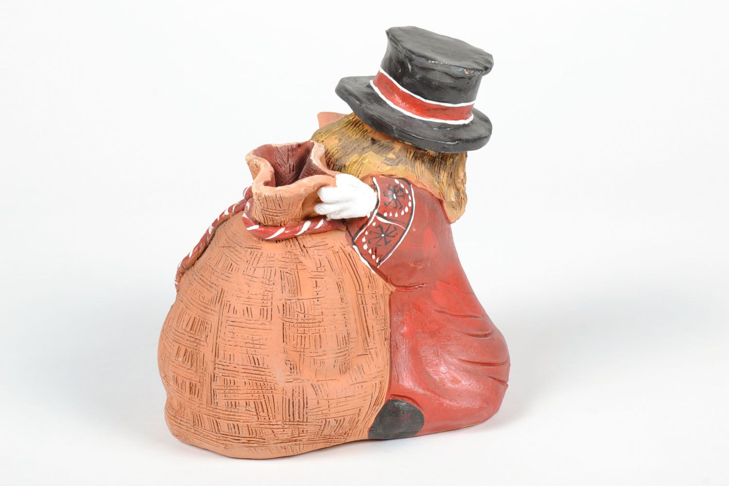 Ceramic money box in the shape of a man with a bag photo 4