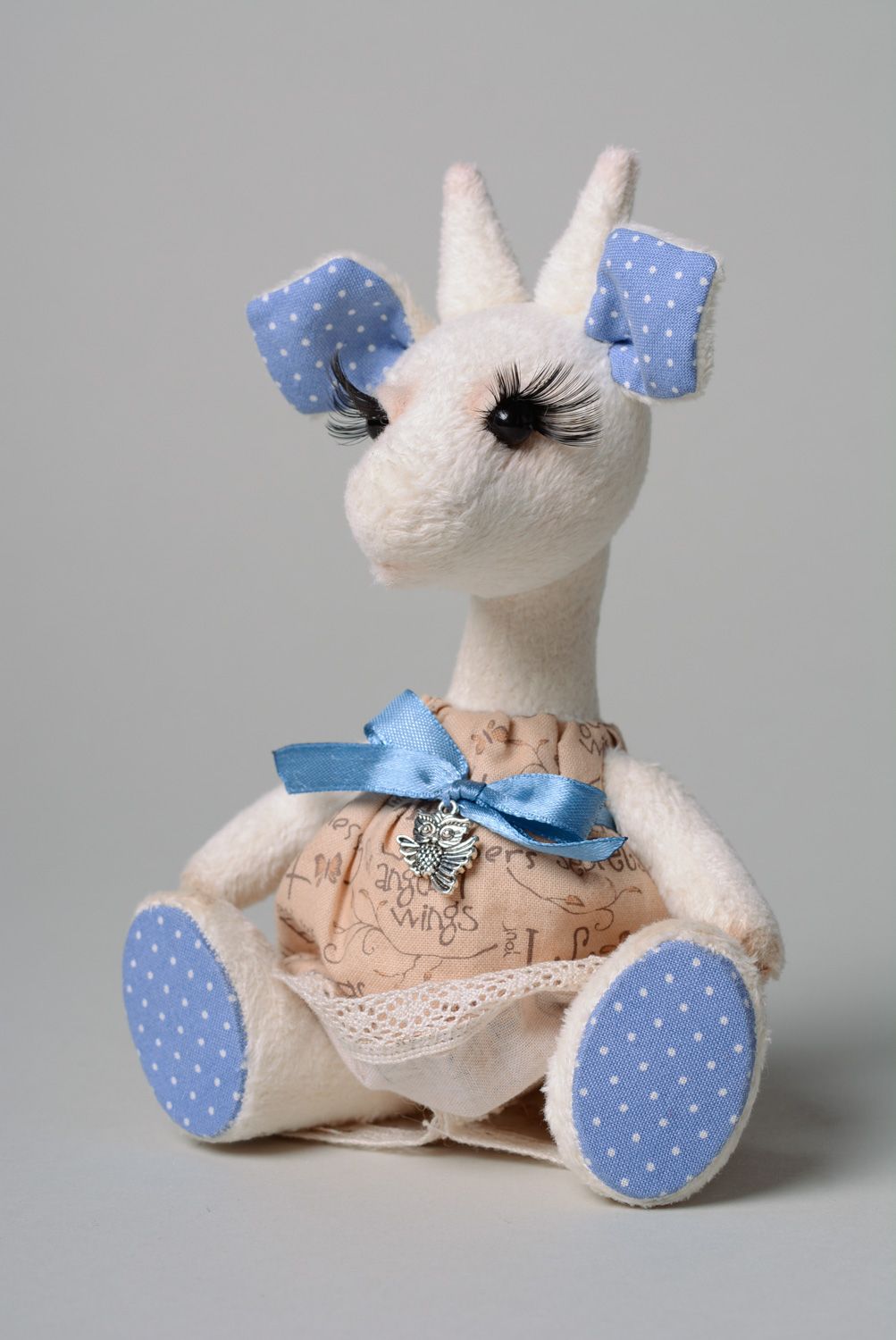 Homemade plush toy goat in cotton dress photo 1
