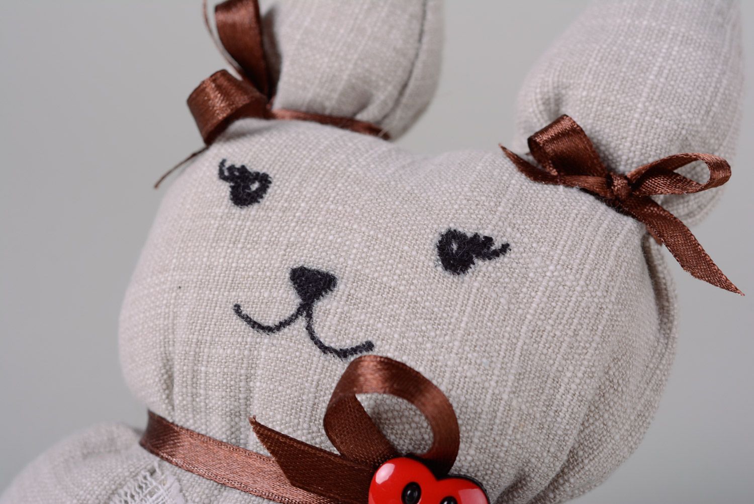 Handmade soft toy sewn of fabric and cotton wool with ribbons Hare photo 2