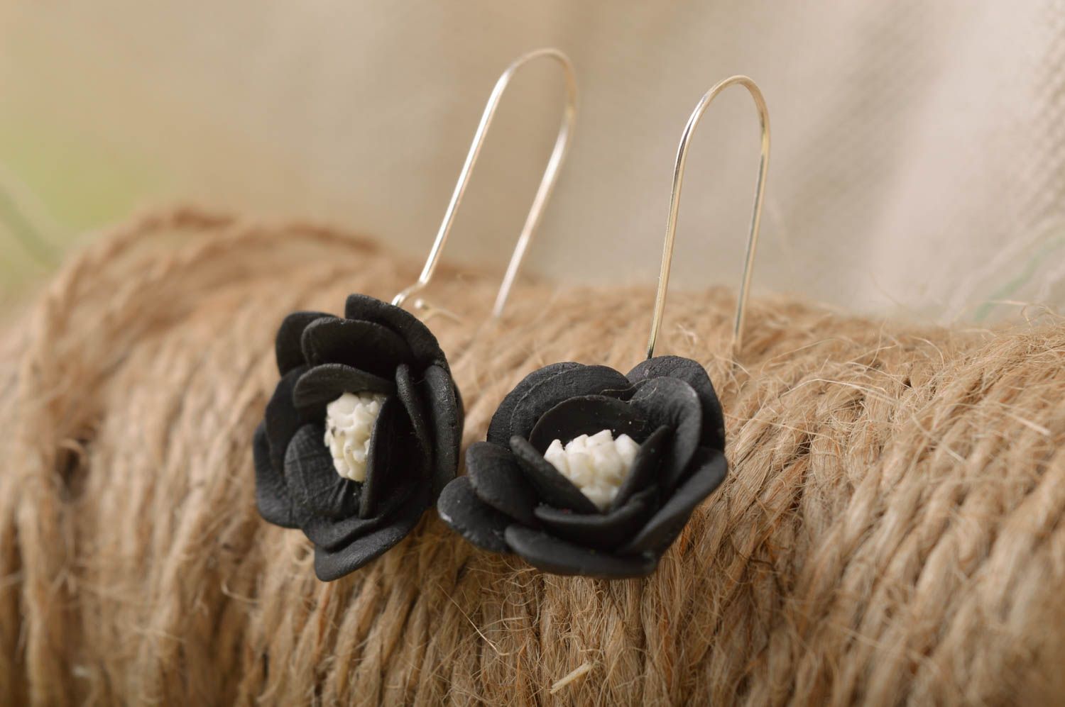 Handmade elegant designer dangle earrings with black cold porcelain flowers photo 1