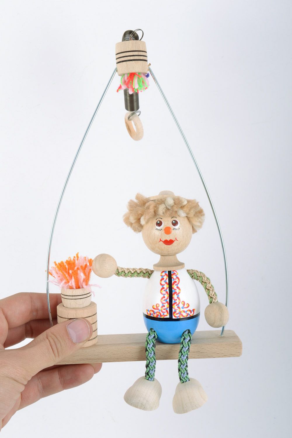 Деревянная игрушка мальчик на качелях с росписью ручной работы авторская фото 2
