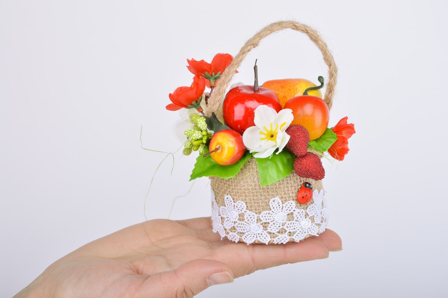 Handmade woven sisal basket with artificial fruit and flowers composition for home decor photo 3