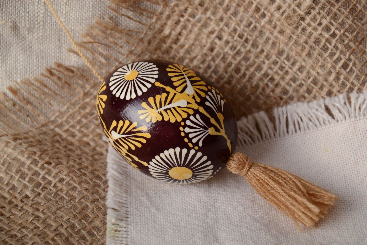 Handmade painted Easter egg with tassel for interior decor photo 1