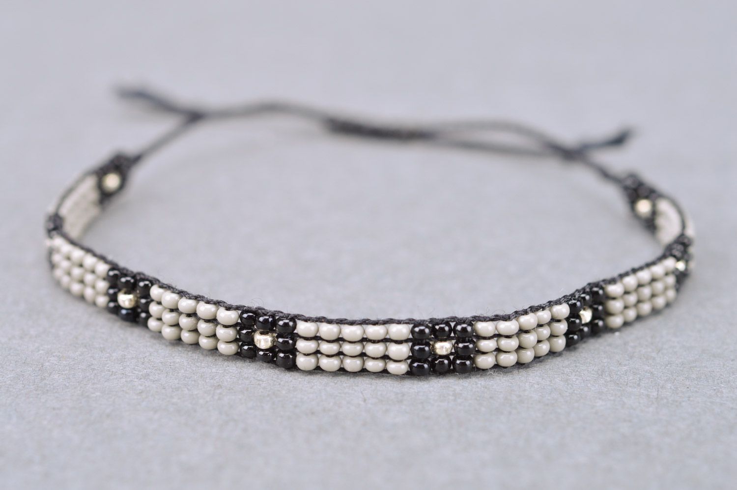 Beautiful black and gray thin beaded bracelet with ties for men photo 5