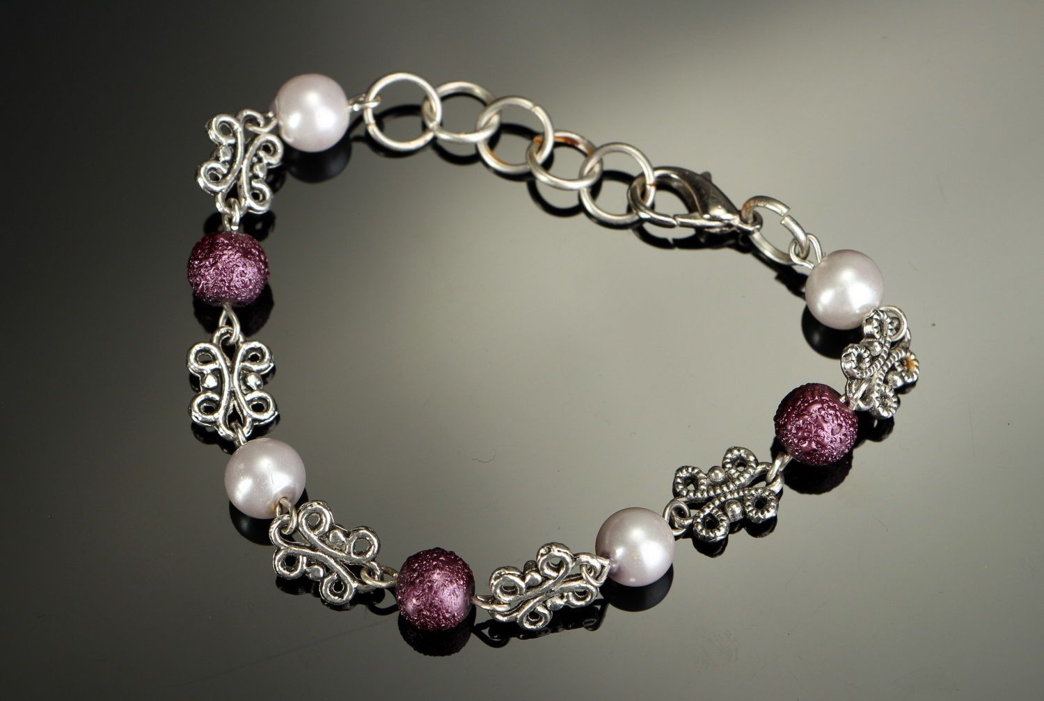 Chain bracelet made ​​of steel and ceramic pearls photo 3