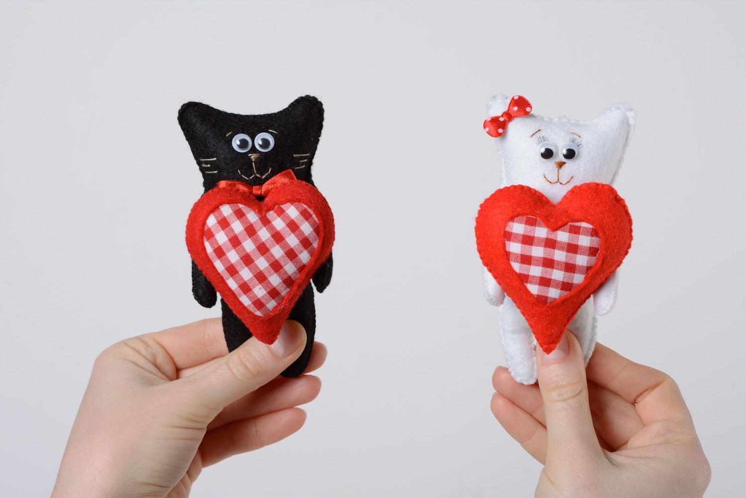 Handmade decorative cute soft toy made of felt and holofiber cats with hearts 2 pieces photo 1