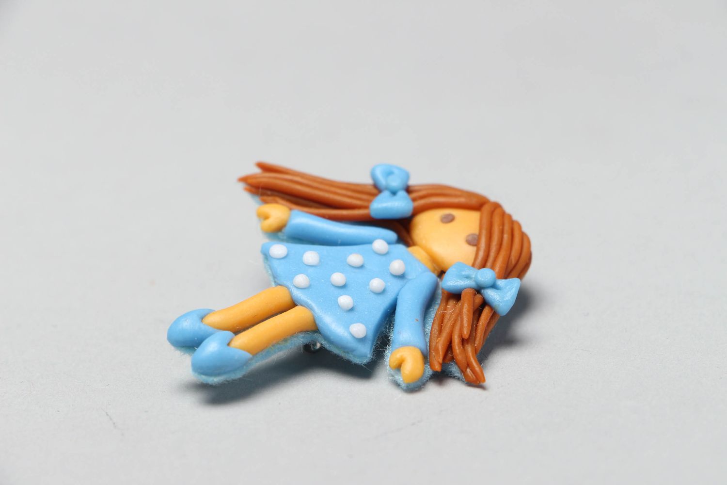 Plastic brooch in the shape of doll Drops photo 2
