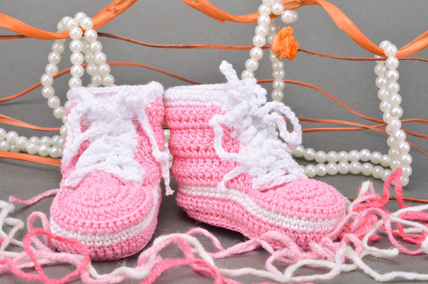 Handmade crocheted pink booties made of cotton in the form of sneakers for girls photo 1